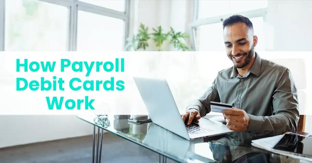 Man sitting at his researching how payroll debit cards work on his laptop.